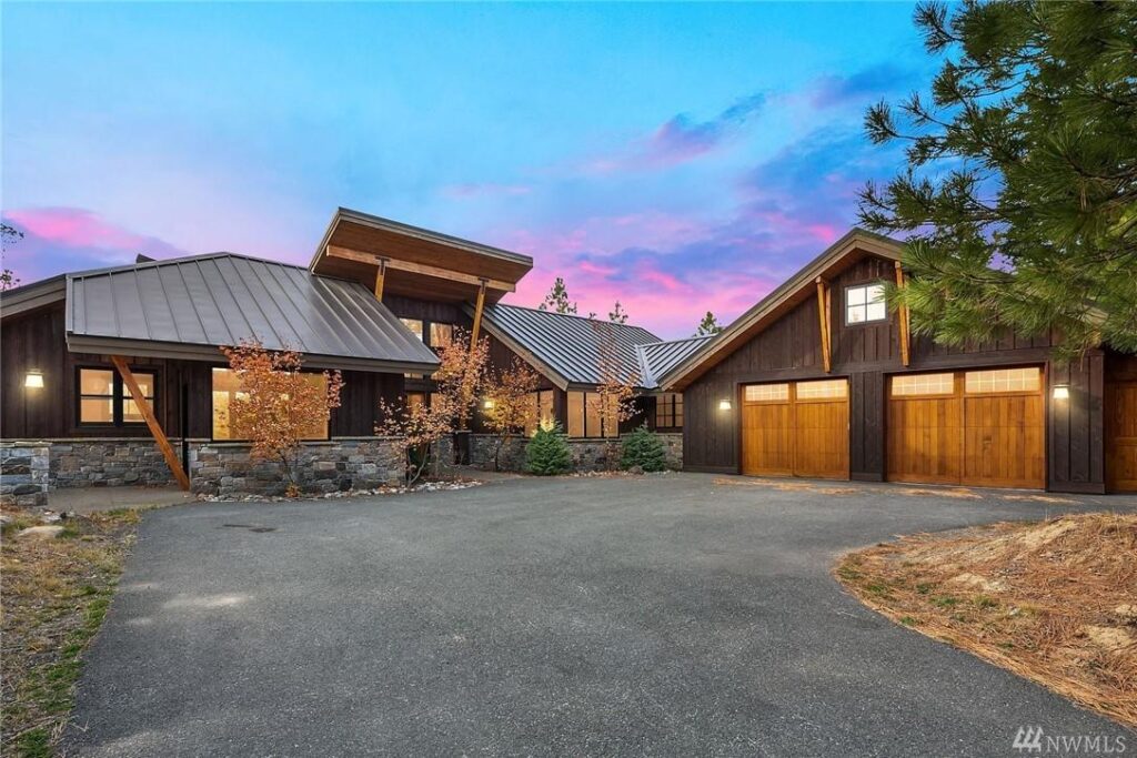 a large home with a driveway and garage.