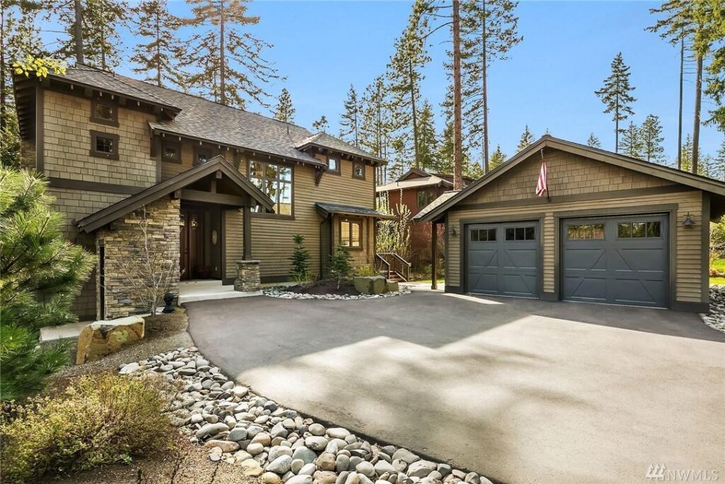 a large house with a driveway in front of it.