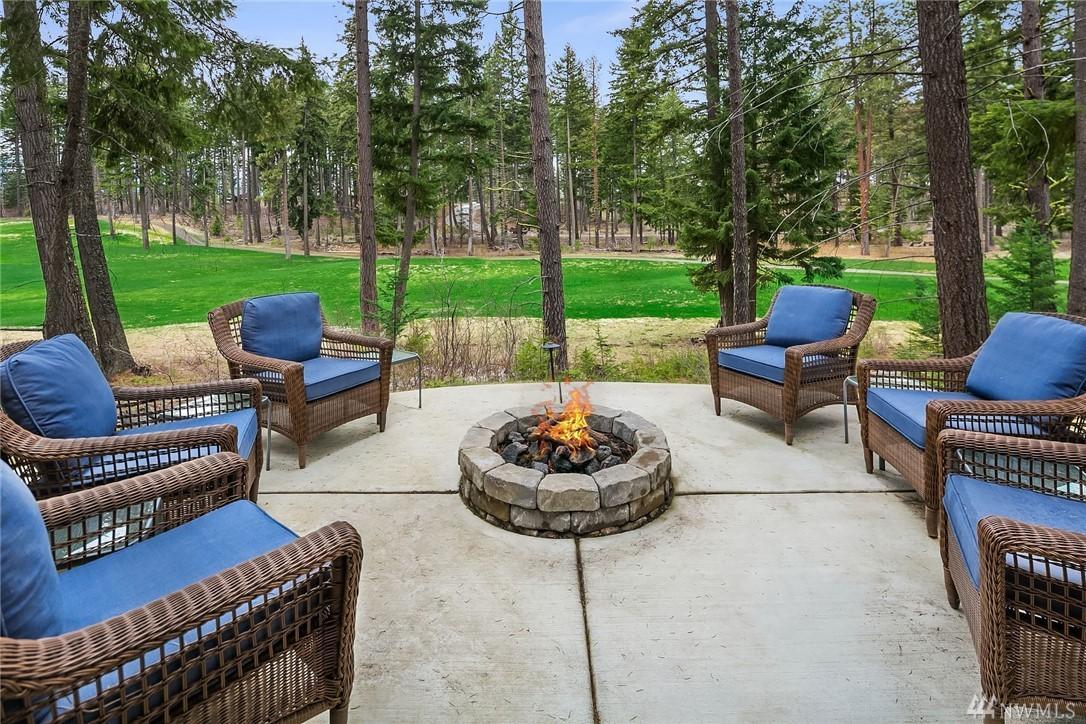 a fire pit sitting in the middle of a patio.