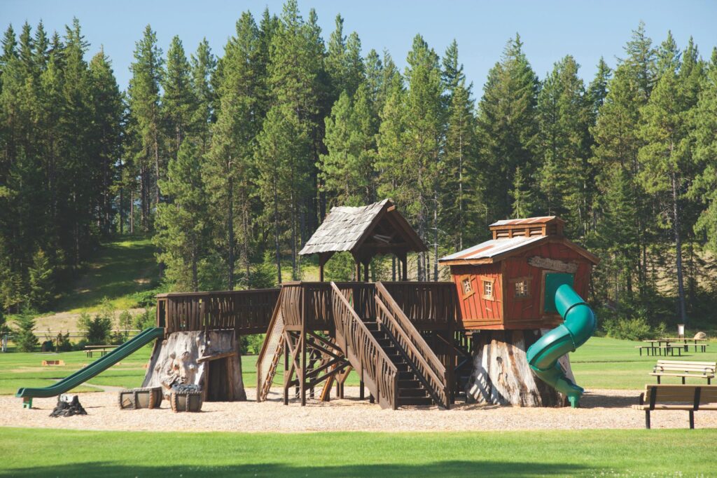 a playground with a slide and a play structure.