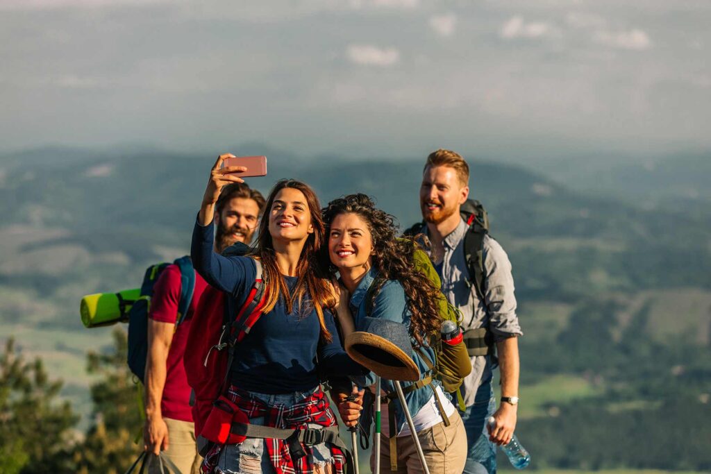 a group of people taking a picture with a camera.