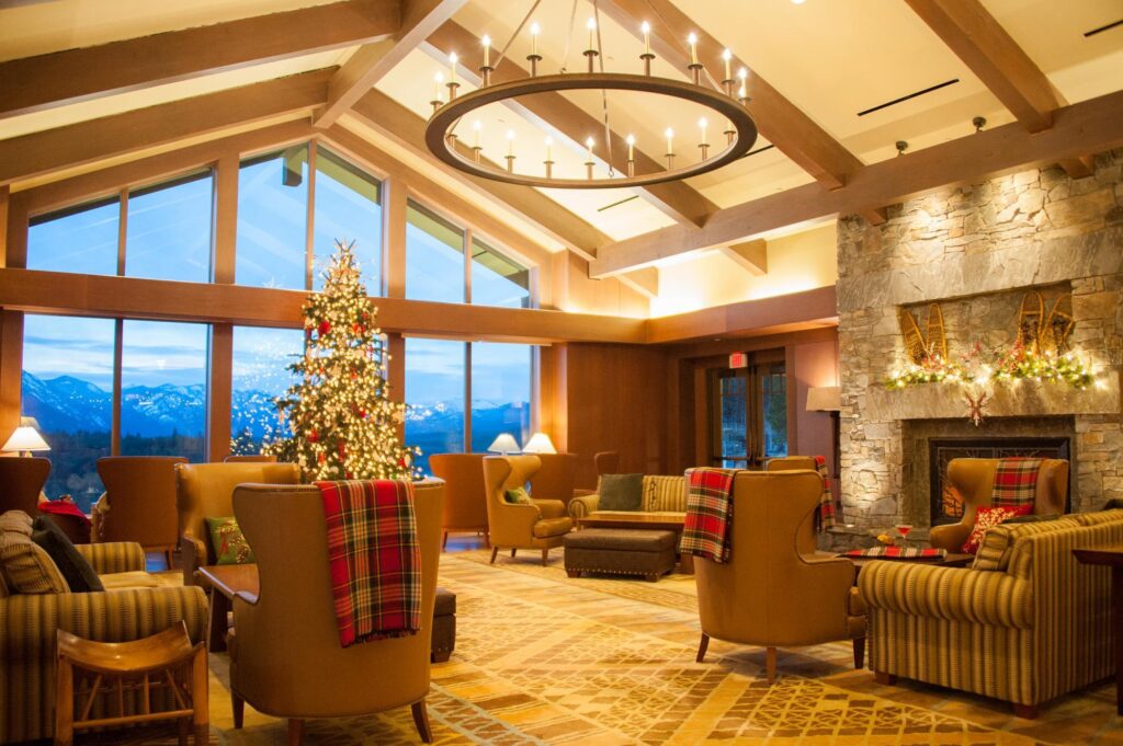 a living room filled with furniture and a christmas tree.